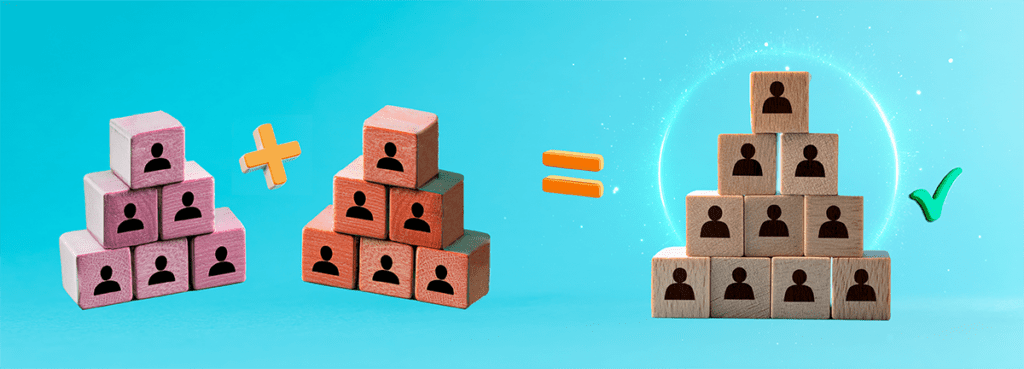 Two separate pyramids made out of wooden blocks combine into one, symbolising team integration with a tick of approval